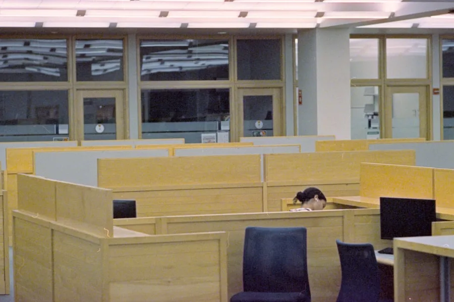 Clean bright open-plan office interior with tidy desks